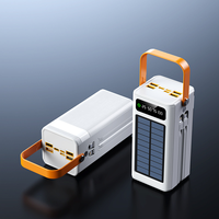 Batterie externe solaire d'urgence noire 22,5 W pour extérieur avec 4 câbles intégrés, entrée mini USB, lampe torche LED et poignée de transport