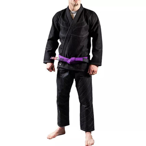 Equipo de artes marciales con pantalones resistentes al desgarro y cintura con cordón disponible en colores blanco, azul y negro - Product Image 1
