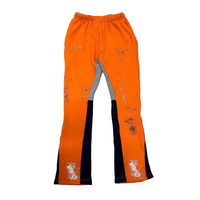 Leggings de compression pour hommes, taille haute élastique, coupe évasée, orange, style streetwear, motif éclaboussures de peinture sur toile, empiècements contrastants, Hip Hop