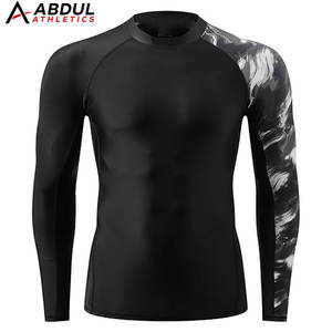 Camiseta Deportiva Ajustada para Hombre, Tejido Elástico, Diseño Profesional, Perfecta para Entrenamiento, Gimnasio y Deportes - Product Image 1