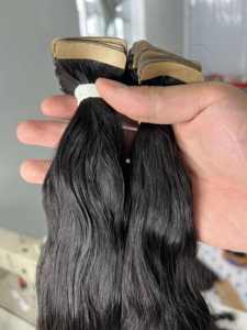 Bande d'extension de cheveux colorés ondulés naturels noirs cachés dans des extensions de cheveux vietnamiens non traités bon marché - Product Image 6