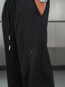 Venta al por mayor de pantalones de los hombres lavados Liso Negro Jogger Pantalones Loose Fit Streetwear Cintura elástica Casual Pantalones de chándal de gran tamaño a granel - Product Image 5