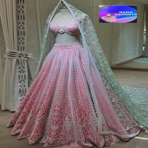 Exquisite Pink Bridal Lehenga with Intricate Threadwork Paired with a Soft Green Embroidered <b>Net</b> <b>Dupatta</b> for a Regal Look - Product Image 1