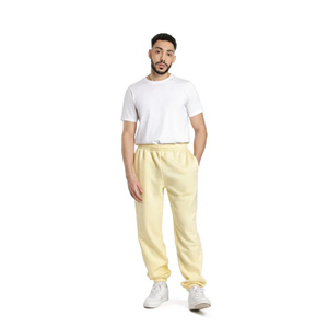 Sentez la chaleur avec ces pantalons de survêtement en polaire pour homme, jaune clair, avec bas élastiques, doux, pour l'entraînement et les loisirs - Product Image 1