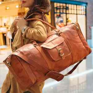 Bolsas de lona de diseñador personalizadas de gran venta, bolsa de lona de viaje de cuero Unisex de tamaño de cabina de cuero genuino a la venta al precio más bajo - Product Image 1