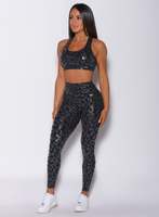 Leggings léopard noir brillant avec logo personnalisé en gros finition brillante taille haute nouveauté et vêtements de sport leggings de gymnastique à la mode pour les femmes