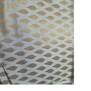 custom made white and gold woven brocade silk fabrics ideal for dress designers and fashion designers in abstract motif design.