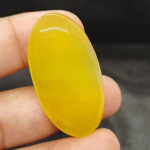 พลอยออนิกซ์สีเหลืองธรรมชาติคุณภาพสูง รูปทรงคาโบชอง ขัดเรียบ รุ่น UDGEMS หมายเลข 585 สำหรับทำเครื่องประดับ ขนาดคละไซส์ - Product Image 1
