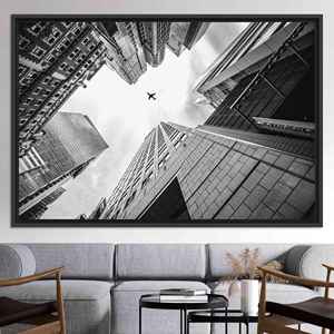 Art mural moderne en verre : impression sur toile de paysage urbain avec avion, toile encadrée noire - Product Image 1