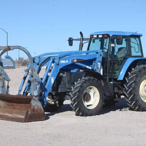 Tracteur HOL LAND TM125 d'occasion, modèle 1051, avec chargeur auto-nivelant 72LA, godet à fixation rapide de 96 pouces avec grappin - Product Image 5