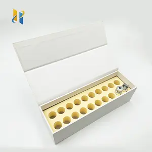 กล่องกระดาษแข็งทรงหนังสือหรูหราน้ำมันทาเล็บสีขาวออกแบบได้เองกล่องของขวัญแม่เหล็กพร้อมแผ่นโฟม EVA