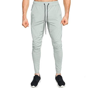 Pantalones deportivos de gimnasio con cremallera lateral y bolsillos, corte ajustado para hombre, subidos por Dress Sports - Product Image 2