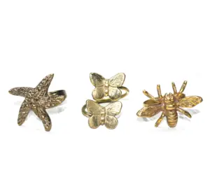 Nuevo juego de diseño creativo de 3 piezas de latón de calidad superior en forma de pez estrella y anillo de servilleta en forma de abeja miel al precio más bajo