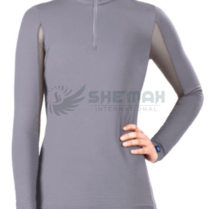 Camisa térmica de compresión de alto rendimiento que ofrece flexibilidad y calidez para entrenamientos ecuestres exigentes - Product Image 2