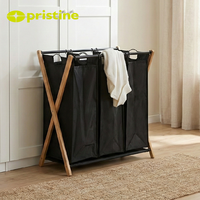 Panier à linge double pliable minimaliste avec cadre métallique en toile noire pour organiser les vêtements, à utiliser dans la cuisine ou la salle de bain