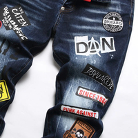 Personnalisation de la broderie du nom de la marque de la mode en coton nouveau style de jeans déchirés longs pour hommes
