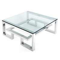 Mesa Auxiliar de Diseño en Cristal Transparente con Base Metálica Dorada Única, Lujosa y Moderna
