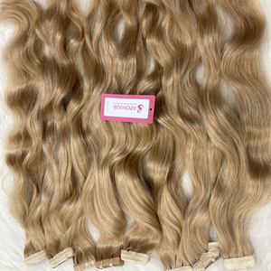 Vente chaude meilleure qualité 100% Extensions de cheveux humains bruts vietnamien miel blond naturel ondulé ruban Ins 40 pièces/100g ruban adhésif - Product Image 1
