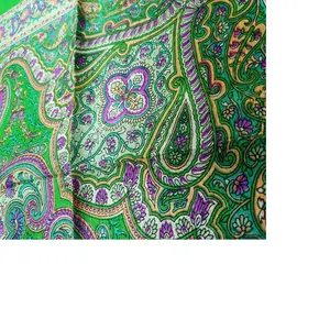 silk screen printed scarves in green color with paisley prints made from 100% silk fabrics ideal for fashion accessory stores