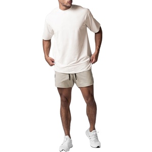 T-shirt unisexe uni en coton respirant grande taille à manches courtes, col rond, style baggy, surdimensionné, blanc à la mode pour hommes - Product Image 1