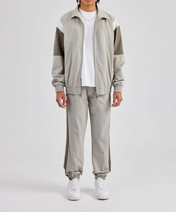 ชุดวอร์ม2ชิ้นผ้าไนลอนโพลีเอสเตอร์แบบรูดซิปขนาดใหญ่ชุดวิ่งออกกำลังกายกันลมสำหรับฤดูใบไม้ผลิออกแบบโลโก้ได้ตามต้องการ - Product Image 4