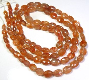 ลูกปัดพลอยซันสโตนธรรมชาติคุณภาพสูง ขนาด 18 นิ้ว รูปทรงรีเหลี่ยมเพชรพลอย สีส้ม ขนาด 6-12 มม. ความเงางามสูง แบบไดโครอิก พลอยแอฟริกัน แบบเม็ดเดี่ยว - Product Image 1