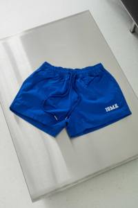 กางเกงขาสั้นผ้าร่มแห้งเร็วของผู้หญิงสำหรับเล่นฟิตเนสชายหาดและวิ่งทรงหลวมสตรีทแวร์ผ้าทอผ้าใบผลิตในเวียดนาม - Product Image 4