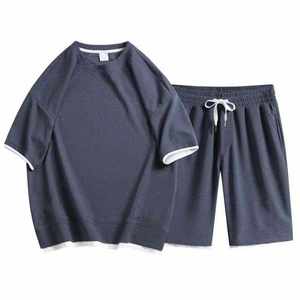 Chándal de nailon de alta calidad para hombre, conjunto ligero e impermeable, pantalones cortos con múltiples bolsillos de OSTROWEARS ENTERPRISES - Product Image 1