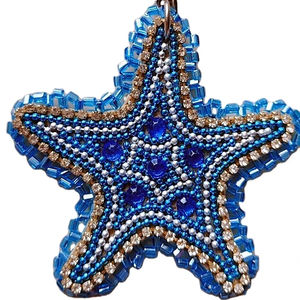 Beautiful star design <b>blue</b> and white coloured seed beaded embroidery keychain and keyring and bag accessories from India - Product Image 1