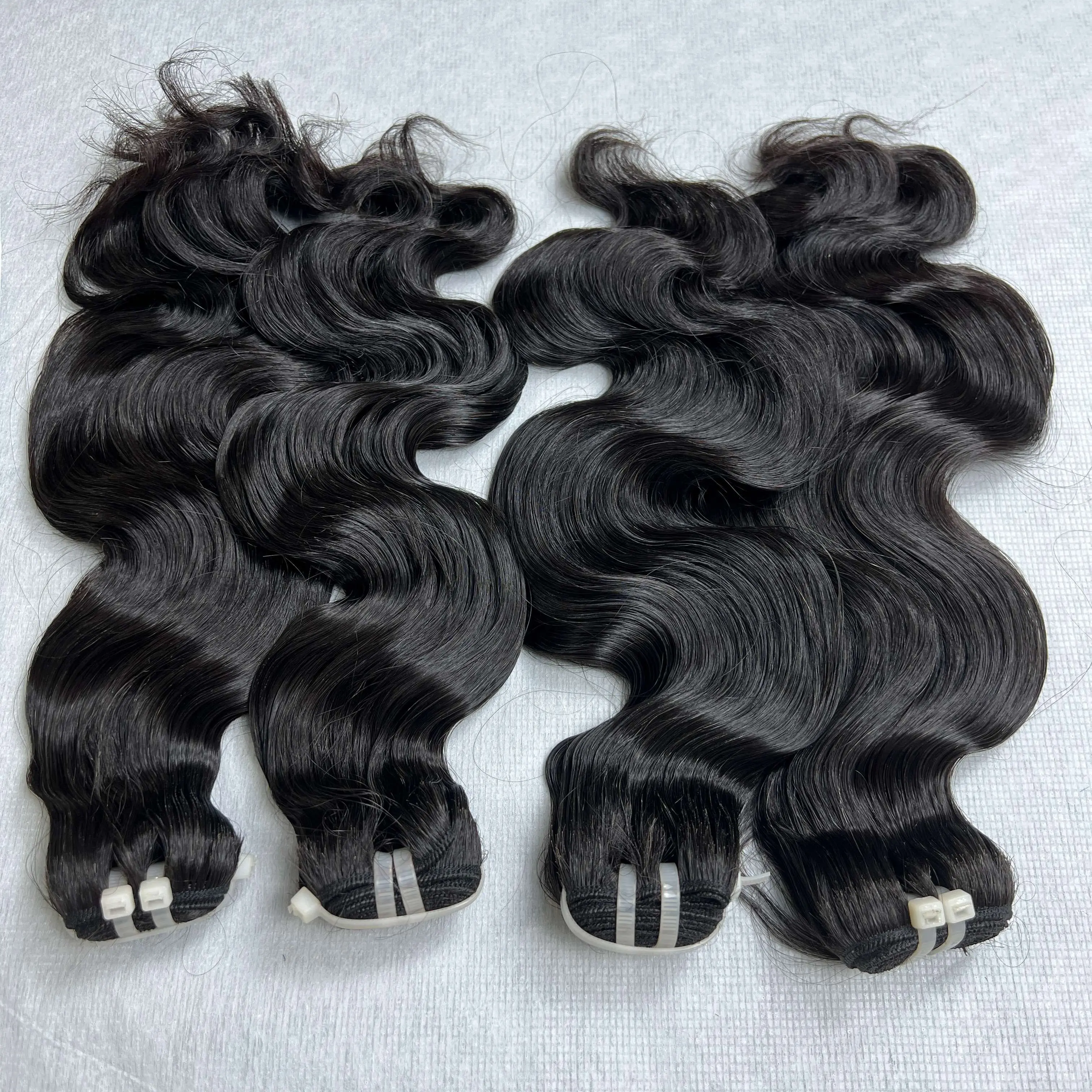 Bundel rambut manusia jalinan gelombang hitam alami orang Malaysia Vietnam rambut Virgin mentah tingkat 10A 12A gelombang tanpa proses jalinan rambut manusia