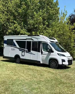 Autocaravana compacta blanca con detalles negros y diseño de puerta lateral - Product Image 4