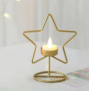 Portavelas decorativo de mesa con diseño de estrella de alambre de Metal, acabado dorado para decoración del hogar y de Navidad - Product Image 1