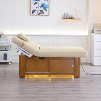 Lit de beauté électrique haut de gamme avec design ergonomique, mousse à mémoire de forme, cuir PU pour salon de beauté, spa, clinique, directement de l'usine