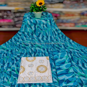 Dirac suisse bleu turquoise avec tissu Gorgor brodé en or blanc |   Ensemble de robe de mariée somalienne de luxe - Product Image 1