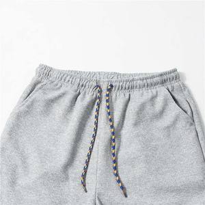 กางเกงวอร์มสำหรับผู้ชายกางเกงผ้าฝ้ายโพลีเอสเตอร์สีเทาผ้าคอตตอนพิมพ์ลายโลโก้ออกแบบได้ตามต้องการ - Product Image 3