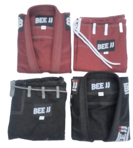 TOP QUALITY KARATE GI UNIFORM HOT SALE MARTIAL ARTS SUITS CUSTOMIZED COLOR TRADITIONAL 220g 100% COTTON DURABLE UNISEX ADULT - Product Image 1