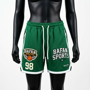Shorts de basket-ball pour femmes de qualité supérieure, en polyester mesh vert, avec poches zippées et logo brodé. - Product Image 1
