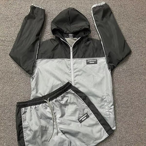 Chándal de poliéster cortavientos de alta calidad, conjunto de dos piezas con cremallera para correr, chándal para hombre - Product Image 1