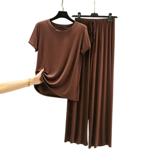 Suministro a granel de ropa de mujer, conjunto informal de dos piezas de Color sólido, estampado de logotipo personalizado, cuello redondo, manga corta, Top y pantalones, trajes - Product Image 6