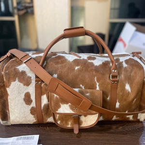 Vente directe d'usine, prix bas, sacs de voyage en cuir de vache, vente chaude, design artisanal tendance, sacs de voyage en cuir de vache - Product Image 1