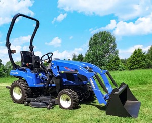 Tractor de ruedas Yuki de 24HP azul con cargador frontal y accesorio de cortadora - Product Image 4