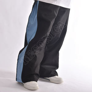 Pantalones Unisex Negros con Paneles Laterales Azules con Cierre Oculto, Cintura Ajustable con Cordón, Dobladillo Elástico y Corte Holgado Estilo Techwear - Product Image 3