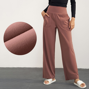 Pantalon de jogging à fond cloche de style automne pour femme Pantalon de yoga évasé à taille haute et décontracté avec poches latérales - Product Image 1