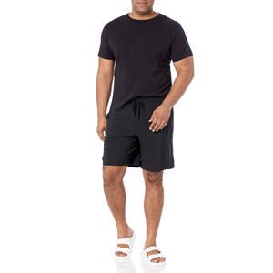 Short d'entraînement décontracté pour homme avec logo Short de gym tricoté en spandex Short de course teint en plaine pour homme été avec motif de poches - Product Image 2