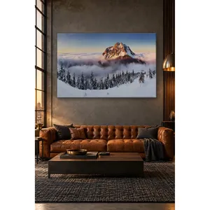 Impression sur toile du sommet enneigé de Fida qui se dévoile au-dessus d'un océan de nuages - Product Image 1