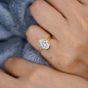 Oval Engagement <b>Ring</b> in Yellow Gold with Bezel Set <b>Diamond</b> Elegant <b>Diamond</b> <b>Rings</b> Collection - Product Image 5