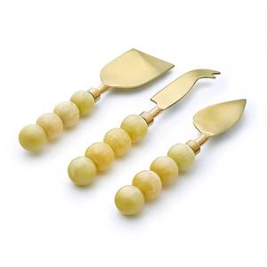 Hot <b>Sale</b> on Top Quality Stainless Steel Handmade Resin Yellow Beads Handle Gold Plated Cheese Cutting <b>Set</b> - Product Image 1