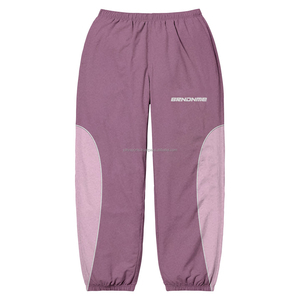 2025 nouveau gros bouton personnalisé pantalons de survêtement rayure femmes Flare pantalon Nylon coupe-vent pantalon pour femmes pantalons et pantalons - Product Image 1