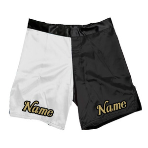 Pantalones Cortos de MMA para Hombre en Satén Blanco y Negro con Logotipo Frontal Bordado, Nombre en el Dobladillo Inferior, Cintura Media, Cierre con Cordón, Transpirables y Casuales - Product Image 1