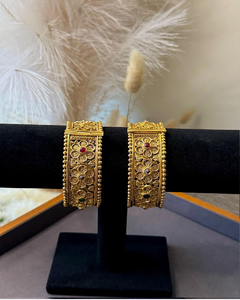 A pair of heavily carved <b>antique</b>-style brass <b>bangles</b>, available at wholesale prices - Product Image 5